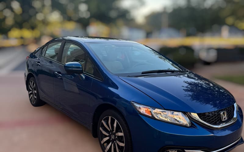 2015 Honda Civic EX-L sedan in Dyno Blue Pearl, front three-quarter view