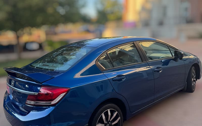 2015 Honda Civic rear three-quarter view with the rear spoiler